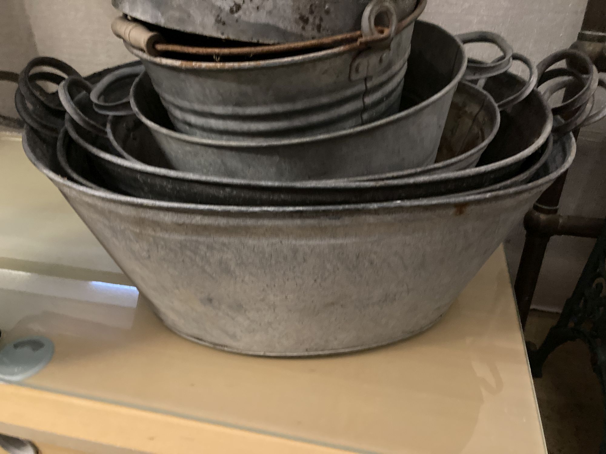 Seven galvanised metal oval tubs and containers, largest 70 x 46cm